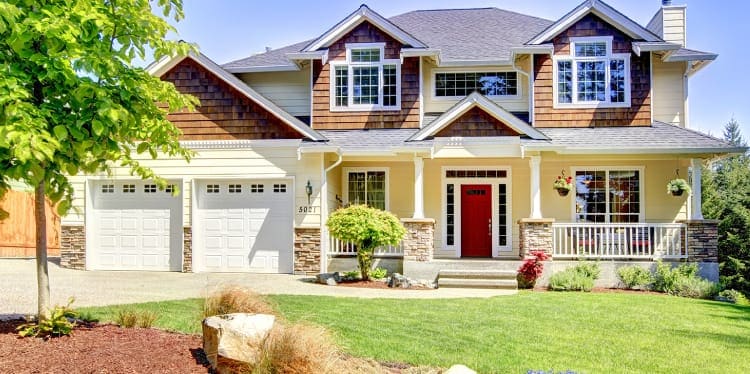 Family picture, husband, wife, young boy and girl smiling while walking in the park